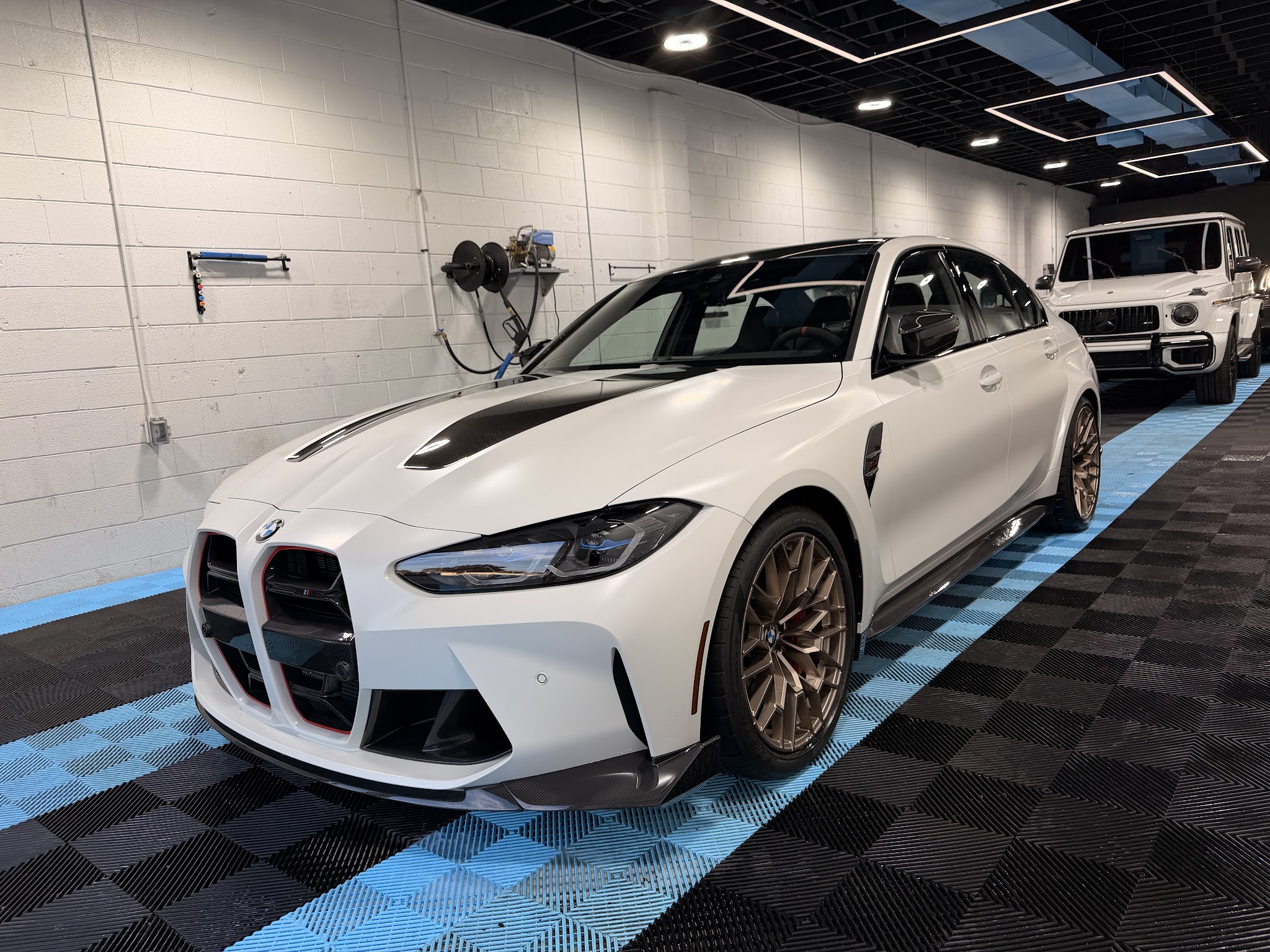 Luxury BMW detailed inside Motor Haus shop bay