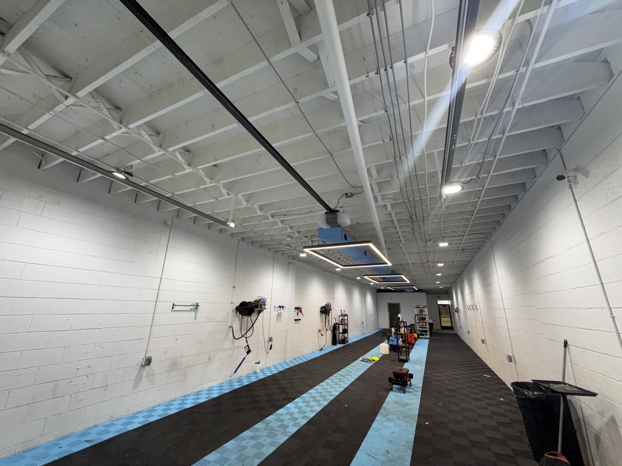 Motor Haus detailing bay with professional lighting